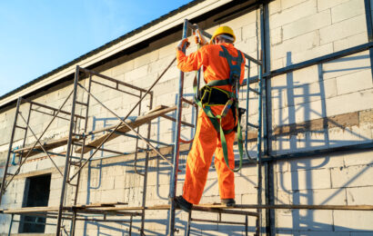 Construction workers wearing safety harness belt during working