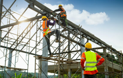 Asian construction worker control in the construction of roof st